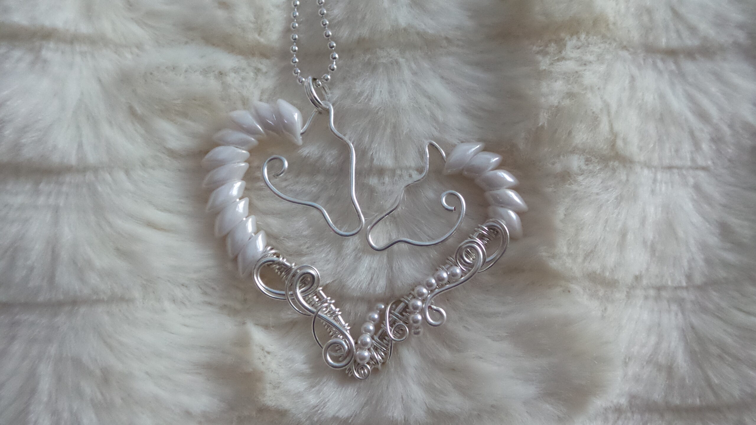 Double Horse Heart Pendant